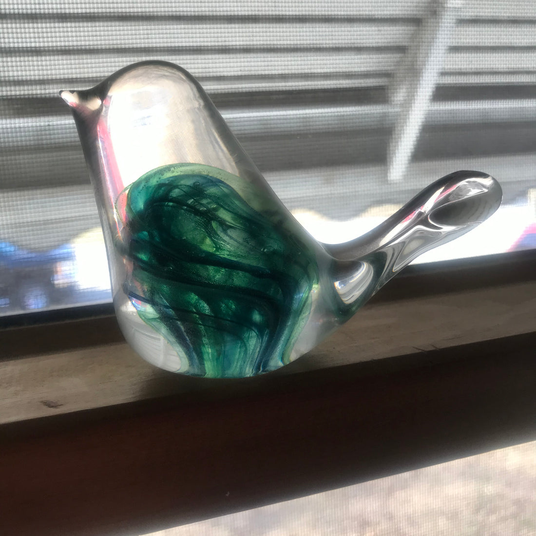 Glass sculpture of a Bird that was created in Ireland. Capturing the light just so. Photo by Penelope at Web of Pen