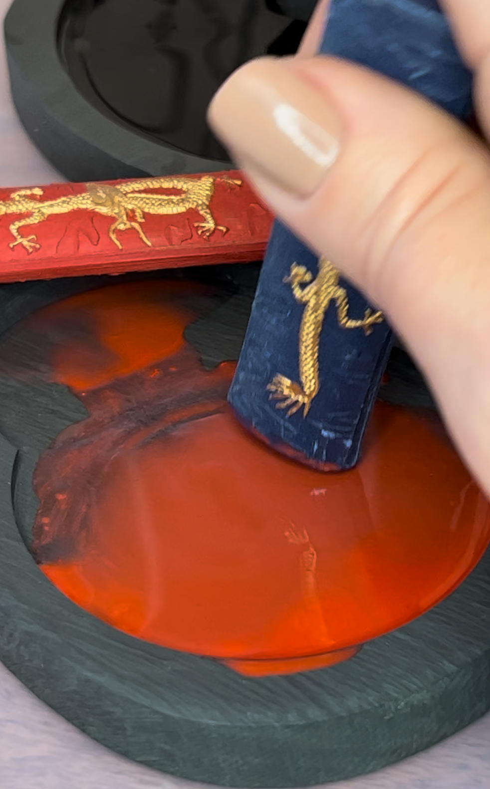 Grinding blue sumi ink on an ink stone