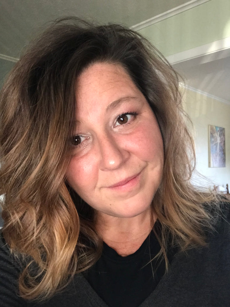 Close-up of the Artist with shoulder-length hair in an indoor setting